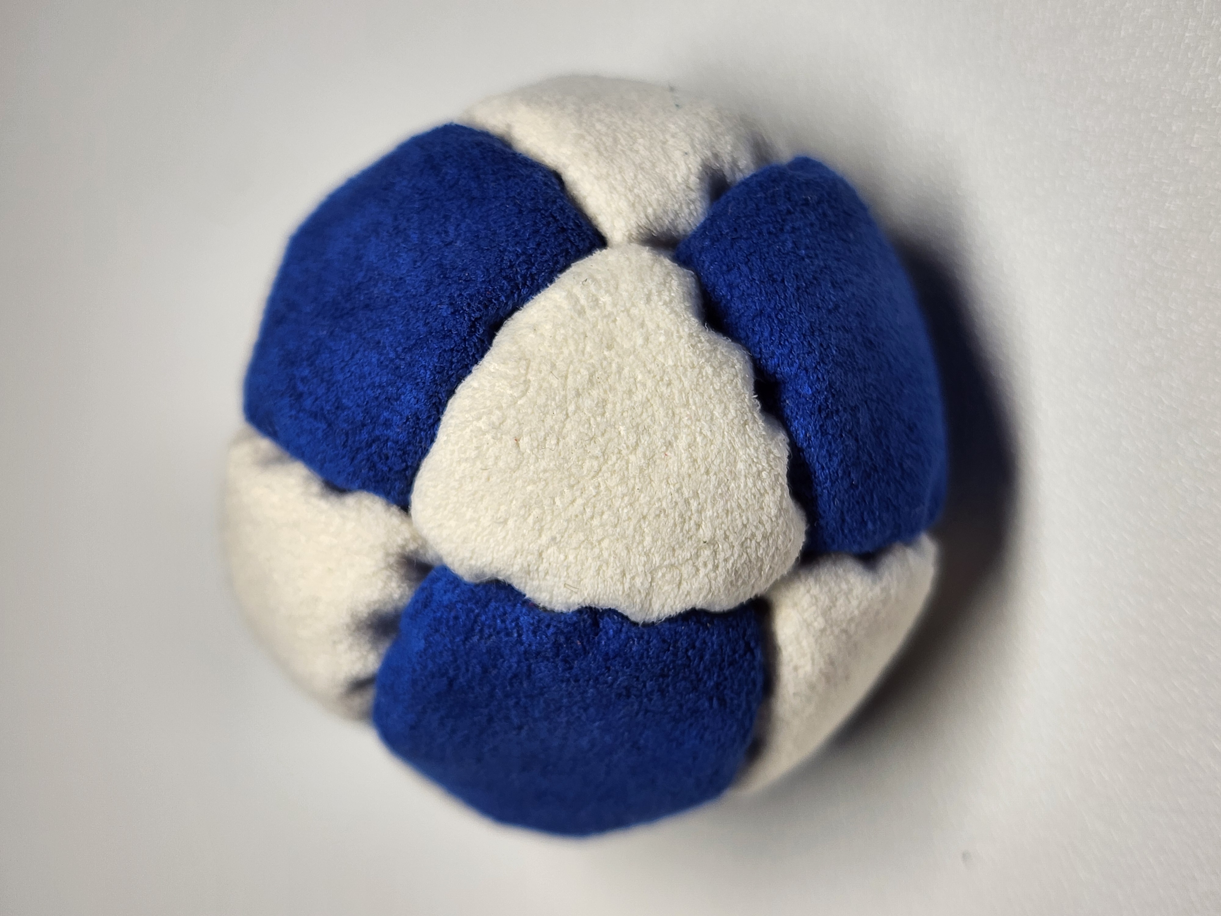 14-Panel Freestyle Footbag by Hacky Snack (#1) — Stitched by freestyle player Hacky Snack. 14-panel footbag (1.9 inch, 65g) made with Ultrasuede LT panels and zinc plated steel fill. Built by a player who knows what a good bag feels like.