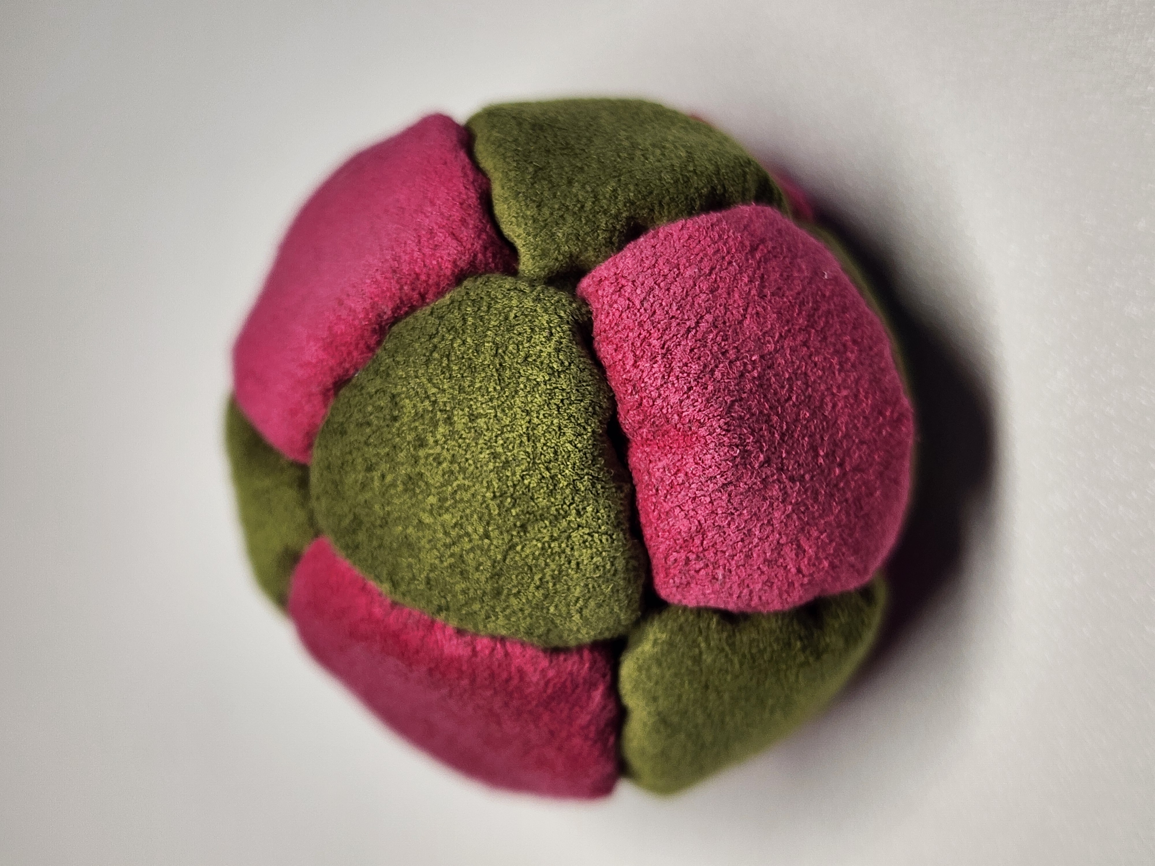 14-Panel Freestyle Footbag by Hacky Snack (#2) — Stitched by freestyle player Hacky Snack. 14-panel footbag (1.9 inch, 65g) made with Ultrasuede LT panels and zinc plated steel fill. Built by a player who knows what a good bag feels like.
