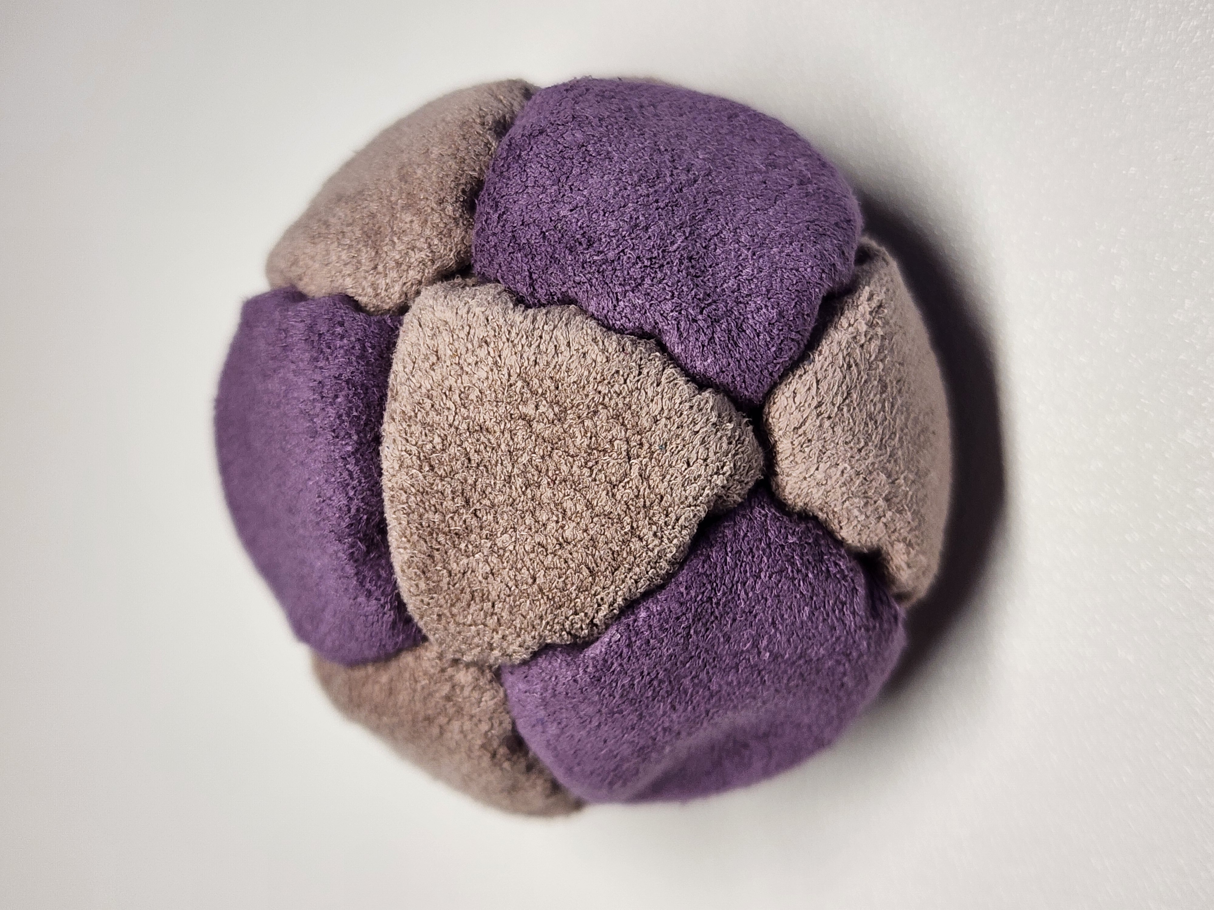 14-Panel Freestyle Footbag by Hacky Snack (#3) — Stitched by freestyle player Hacky Snack. 14-panel footbag (1.9 inch, 65g) made with Ultrasuede LT panels and zinc plated steel fill. Built by a player who knows what a good bag feels like.