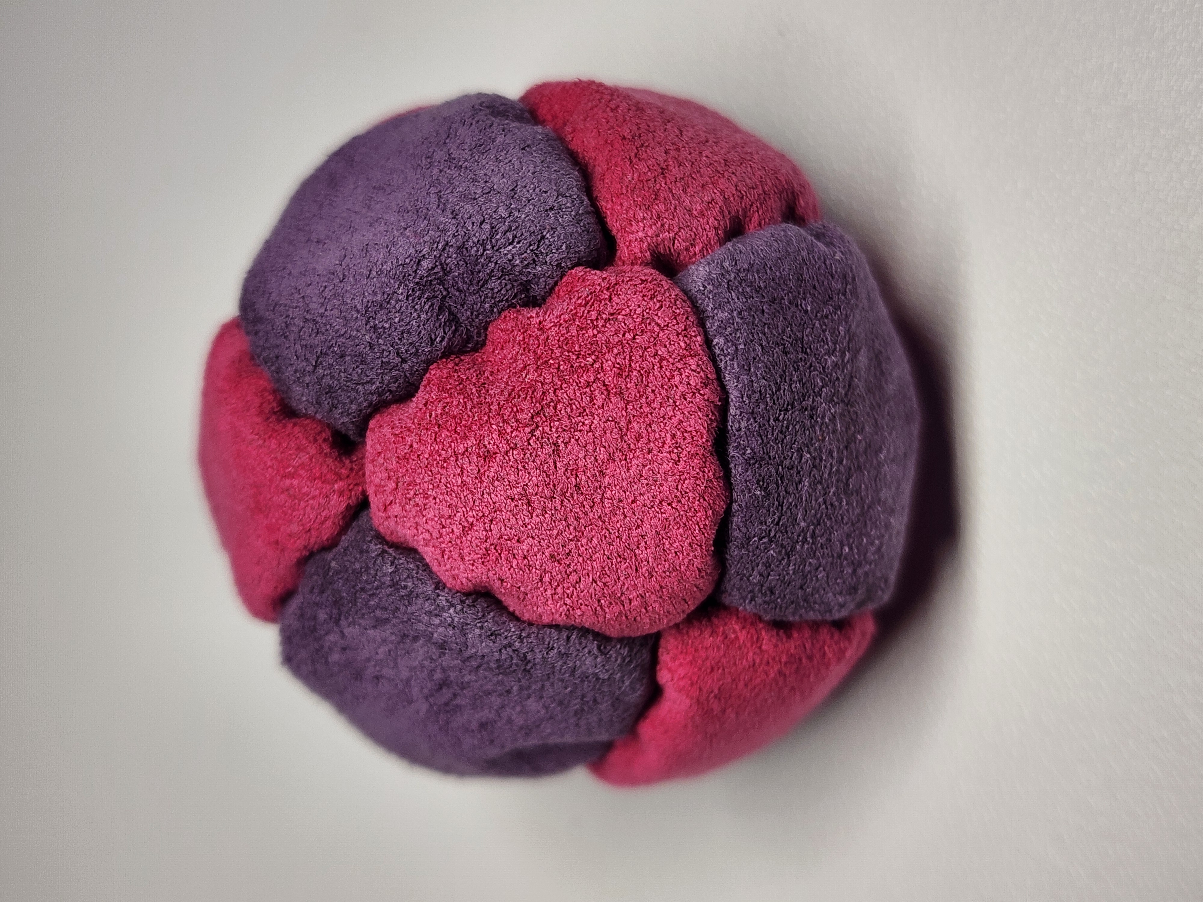 14-Panel Freestyle Footbag by Hacky Snack (#5) — Stitched by freestyle player Hacky Snack. 14-panel footbag (1.9 inch, 65g) made with Ultrasuede LT panels and zinc plated steel fill. Built by a player who knows what a good bag feels like.