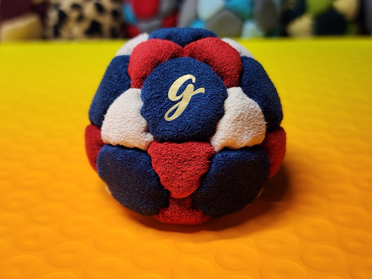 32-Panel Footbag by G (#98) — Stitched by freestyle player G. A 32-panel pro freestyle bag made entirely from Ultrasuede LX — the gold standard fabric for freestyle footbags. 32 panels, 1.9 inch, 65g.