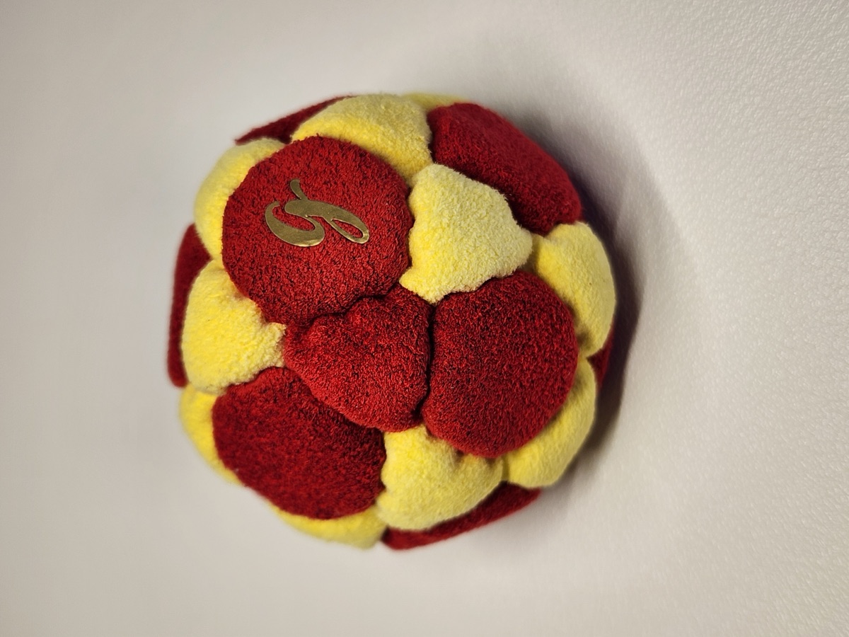 32-Panel Footbag by G (#62) — Stitched by freestyle player G. A 32-panel pro freestyle bag made from Ultrasuede LX — the gold standard fabric for freestyle footbags. 32 panels, 1.9 inch, 65g.