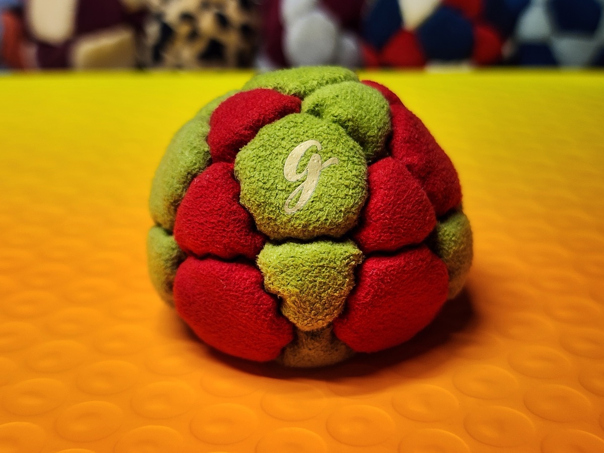 32-Panel Footbag by G (#91) — Stitched by freestyle player G. A 32-panel pro freestyle bag made from Lamous — a premium synthetic suede with a smooth, consistent feel. 32 panels, 1.9 inch, 65g.