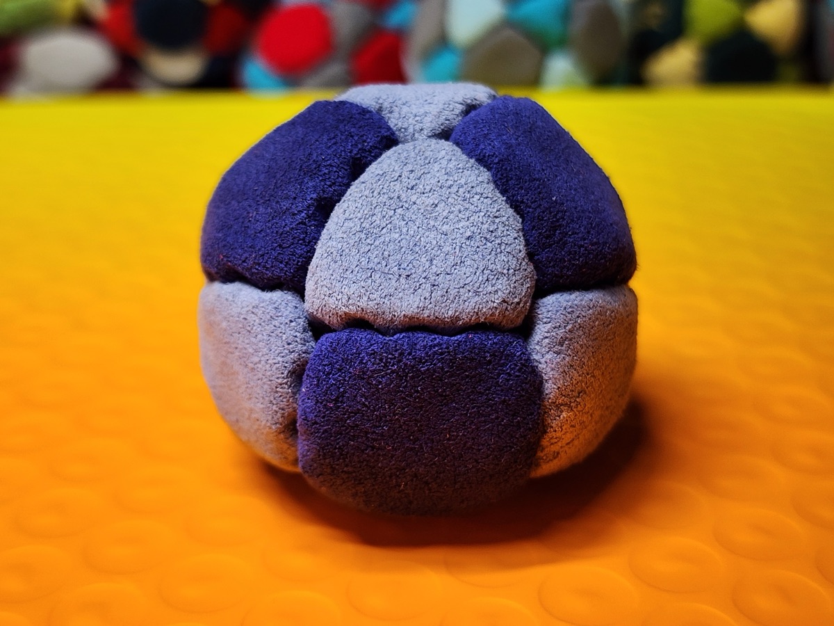 14-Panel Footbag by Hacky Snack (#34) — Stitched by freestyle player Hacky Snack. The real deal — made from Ultrasuede LT, hand-stitched by a player, tuned for freestyle. 14 panels, 1.8 inch, 67g.