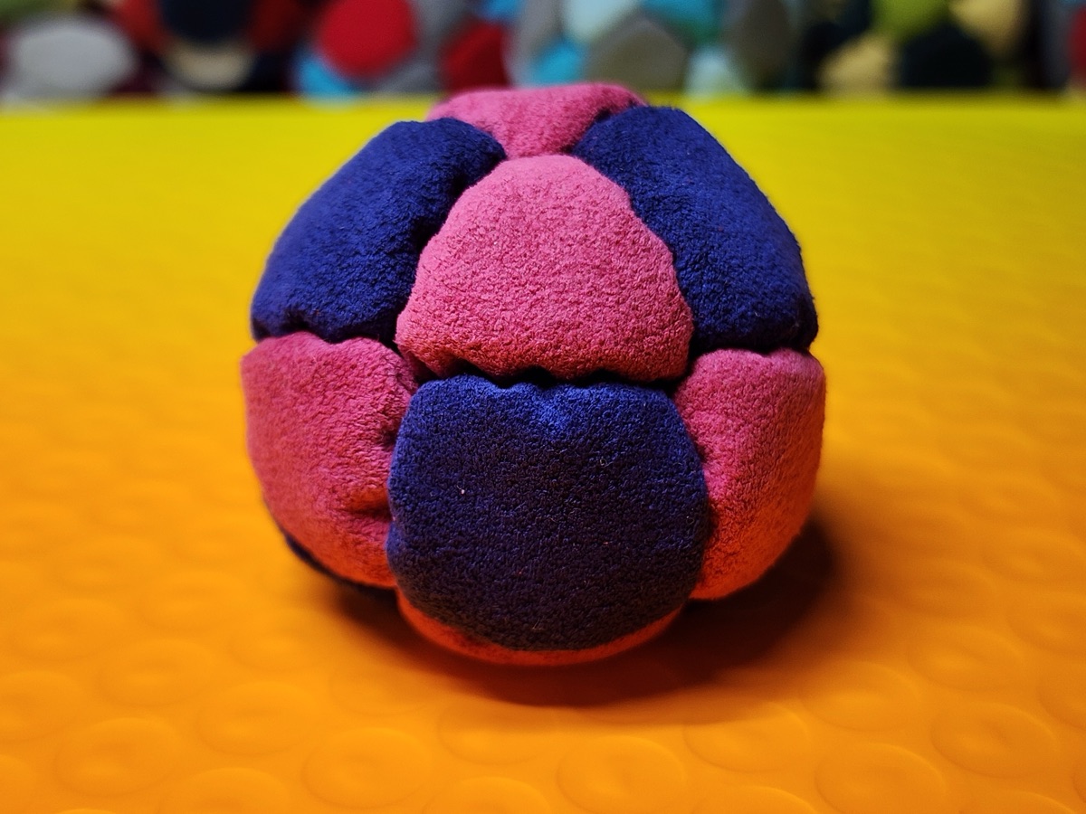 14-Panel Footbag by Hacky Snack (#36) — Stitched by freestyle player Hacky Snack. The real deal — made from Ultrasuede LT, hand-stitched by a player, tuned for freestyle. 14 panels, 1.8 inch, 67g.