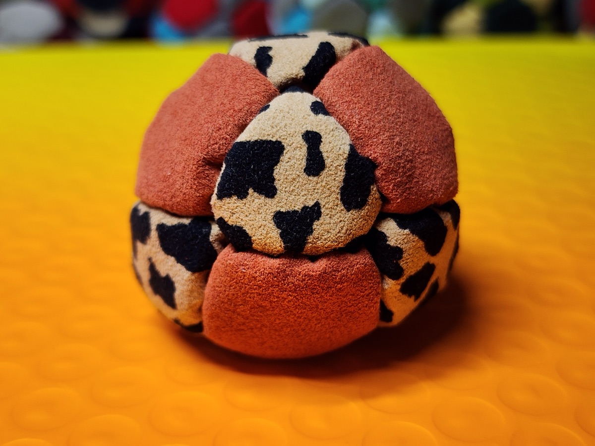 14-Panel Footbag by Hacky Snack (#37) — Stitched by freestyle player Hacky Snack. The real deal — made from Ultrasuede LT, hand-stitched by a player, tuned for freestyle. 14 panels, 1.8 inch, 67g.