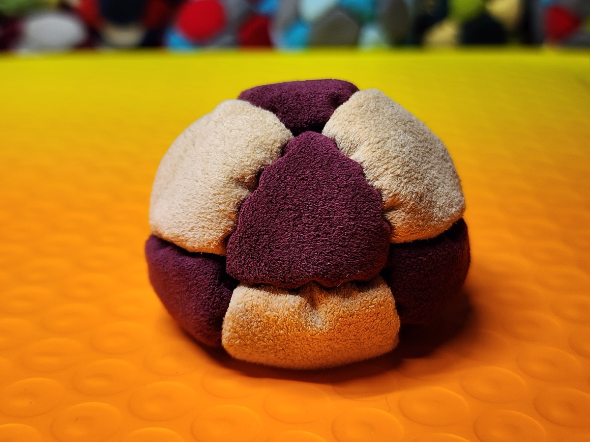 14-Panel Footbag by Hacky Snack (#40) — Stitched by freestyle player Hacky Snack. The real deal — made from Ultrasuede LT, hand-stitched by a player, tuned for freestyle. 14 panels, 1.8 inch, 67g.