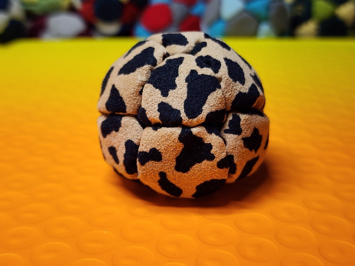 14-Panel Footbag by Hacky Snack (#42) — Stitched by freestyle player Hacky Snack. The real deal — made from Ultrasuede LT, hand-stitched by a player, tuned for freestyle. 14 panels, 1.8 inch, 67g.
