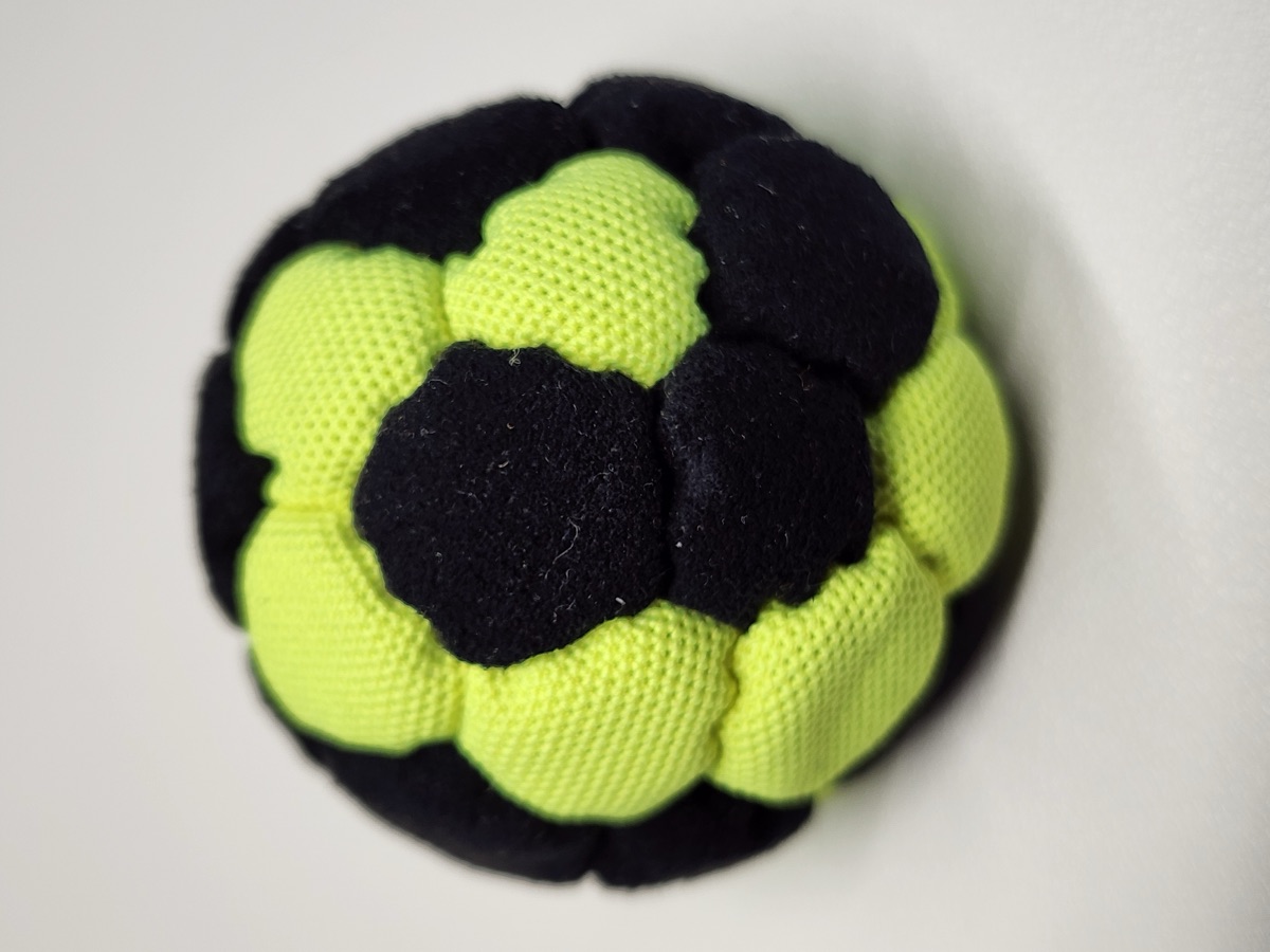 32-Panel Footbag by Mantis (#11) — Stitched by Nick Landes (Mantis Footbag). A handmade 32-panel freestyle footbag made with High Viz material and hybrid fill. 1.9 inch, 65g.