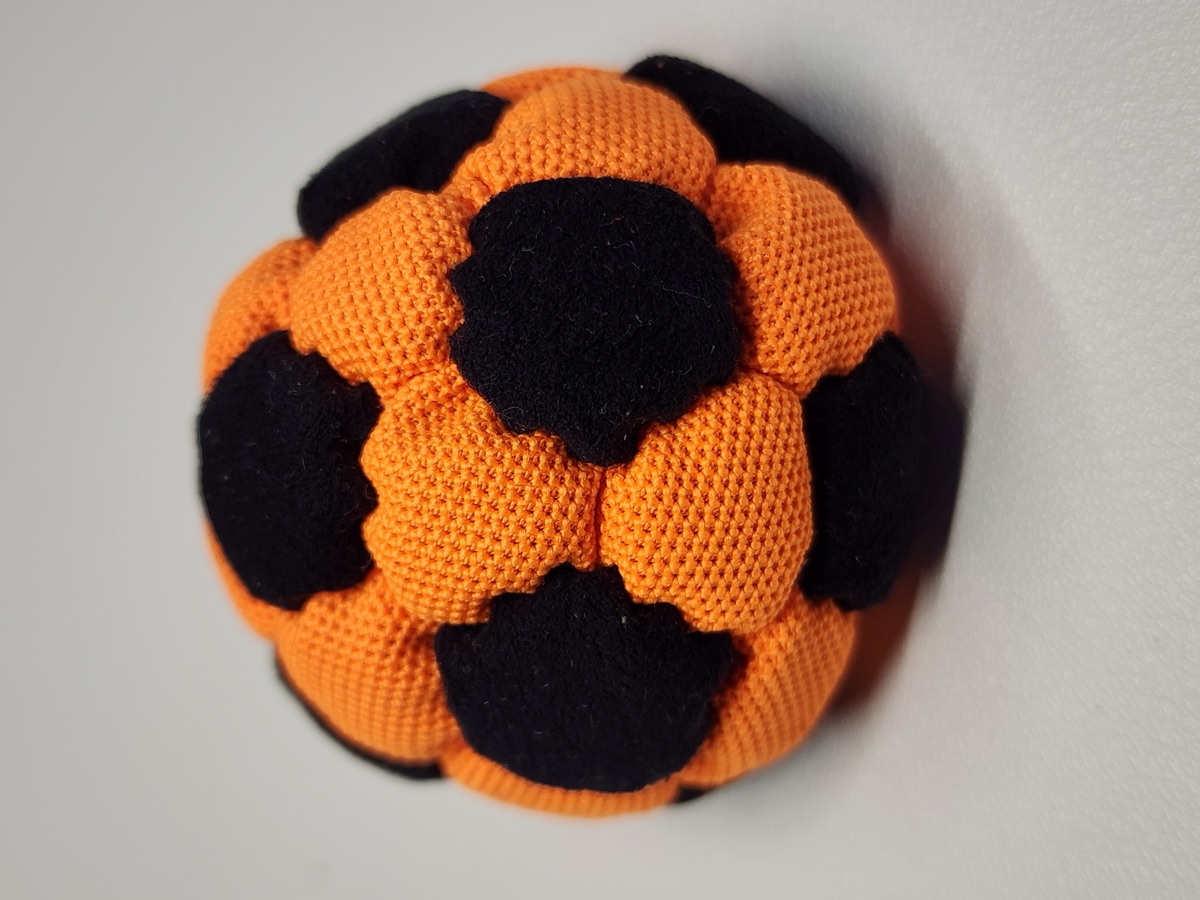 32-Panel Footbag by Mantis (#12) — Stitched by Nick Landes (Mantis Footbag). A handmade 32-panel freestyle footbag made with High Viz material and hybrid fill. 1.9 inch, 65g.