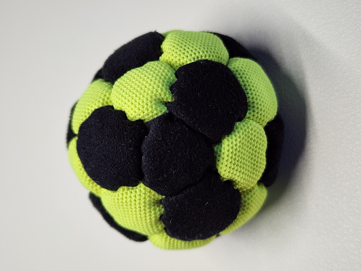 32-Panel Footbag by Mantis (#14) — Stitched by Nick Landes (Mantis Footbag). A handmade 32-panel freestyle footbag made with High Viz material and hybrid fill. 1.9 inch, 65g.